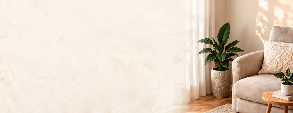 Warm sunlit living room interior with plants and a cream armchair